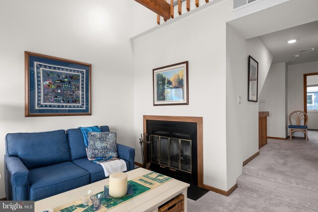 39947 Narrows Rd Unit 13, Fenwick Island, DE 19944 - carpeted living area with baseboards, a glass covered fireplace, and visible vents