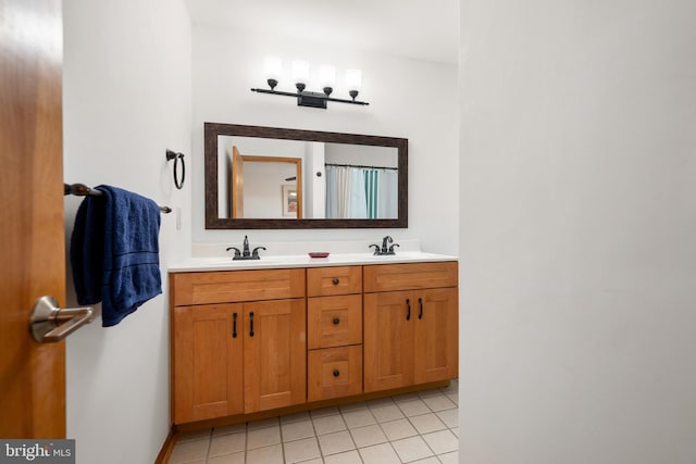 39947 Narrows Rd Unit 13, Fenwick Island, DE 19944 - bathroom featuring double vanity, a sink, and tile patterned flooring