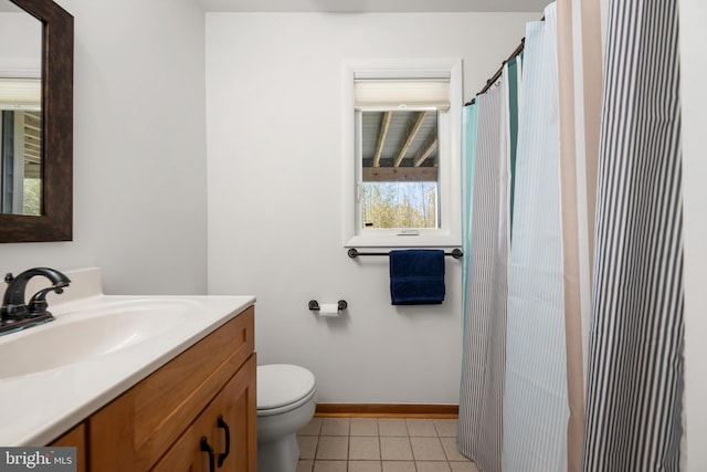 39947 Narrows Rd Unit 13, Fenwick Island, DE 19944 - bathroom with vanity, baseboards, tile patterned flooring, and toilet
