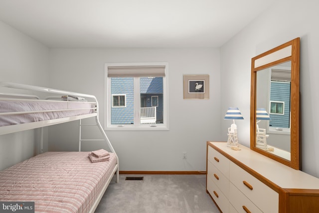 39947 Narrows Rd Unit 13, Fenwick Island, DE 19944 - bedroom featuring baseboards, visible vents, and light carpet