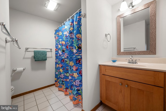 39947 Narrows Rd Unit 13, Fenwick Island, DE 19944 - bathroom with vanity, toilet, baseboards, a shower with shower curtain, and tile patterned floors