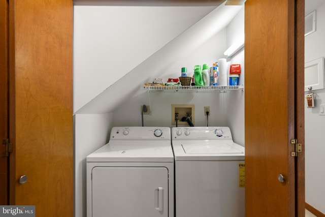 39947 Narrows Rd Unit 13, Fenwick Island, DE 19944 - laundry room featuring independent washer and dryer, laundry area, and visible vents