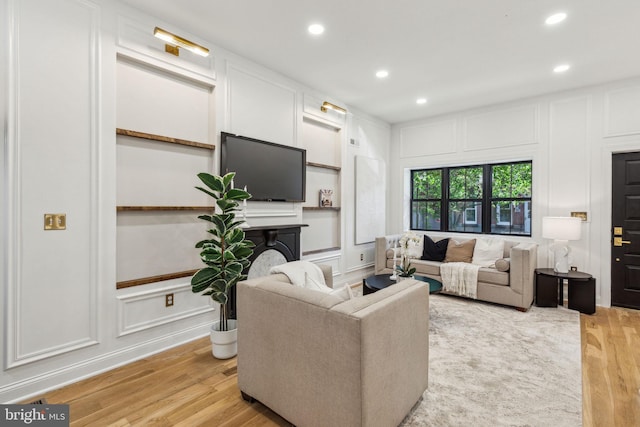 213 Morris St, Philadelphia, PA 19148 - living room with recessed lighting, a decorative wall, and light wood-type flooring
