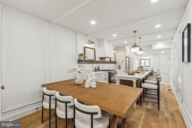 213 Morris St, Philadelphia, PA 19148 - dining room with baseboards, beamed ceiling, recessed lighting, and light wood-style flooring