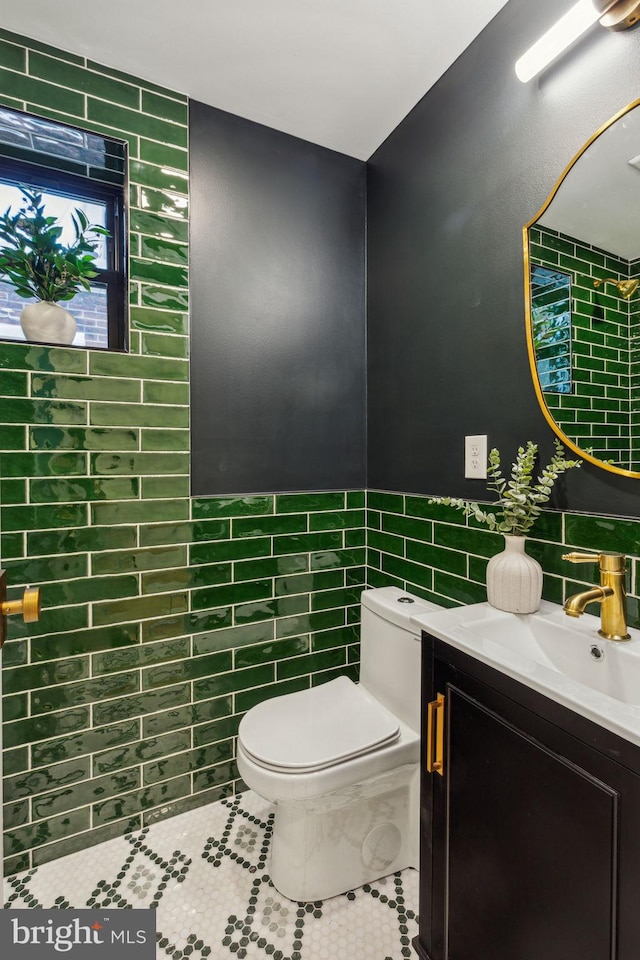 213 Morris St, Philadelphia, PA 19148 - bathroom with tile walls, tile patterned floors, vanity, and toilet