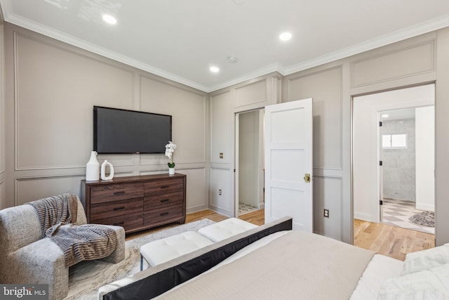 213 Morris St, Philadelphia, PA 19148 - bedroom with recessed lighting, ornamental molding, light wood-style flooring, and a decorative wall