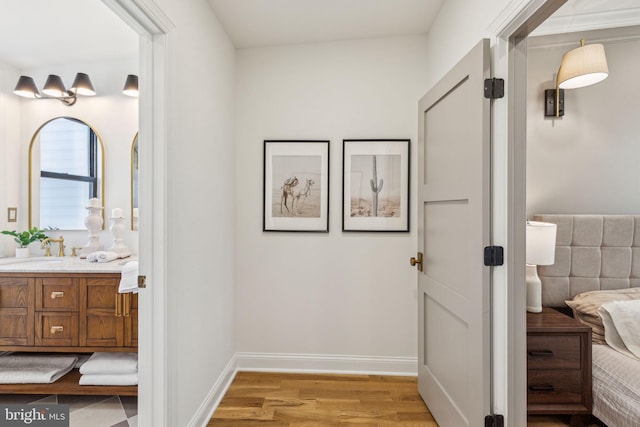 213 Morris St, Philadelphia, PA 19148 - bathroom with vanity, baseboards, and wood finished floors