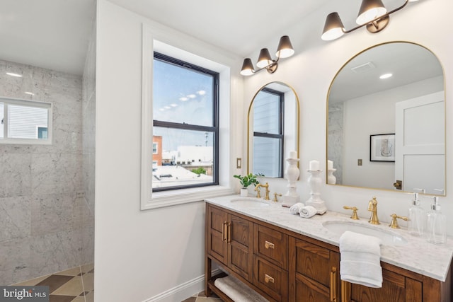 213 Morris St, Philadelphia, PA 19148 - bathroom with a sink, walk in shower, double vanity, and visible vents