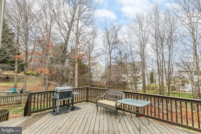 wooden deck with area for grilling