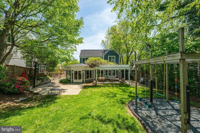 back of property featuring a lawn, an outdoor living space, a patio area, and fence