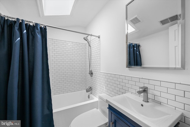 full bathroom with tile walls, toilet, shower / bathtub combination with curtain, and visible vents
