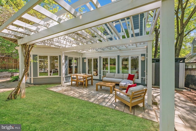 sunroom / solarium featuring a skylight, plenty of natural light, and an outdoor hangout area