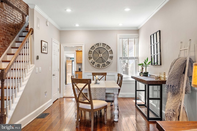 dining area with visible vents, ornamental molding, stairs, hardwood / wood-style floors, and recessed lighting