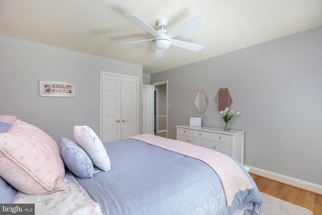 10808 Fieldwood Dr, Fairfax, VA 22030 - bedroom featuring wood finished floors, a closet, baseboards, and a ceiling fan