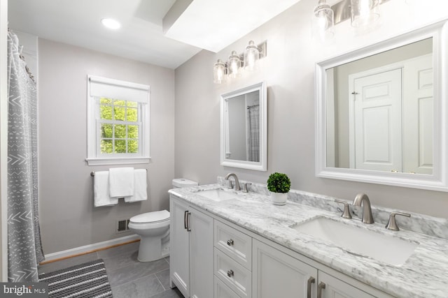 10808 Fieldwood Dr, Fairfax, VA 22030 - bathroom featuring toilet, double vanity, baseboards, recessed lighting, and tile patterned flooring