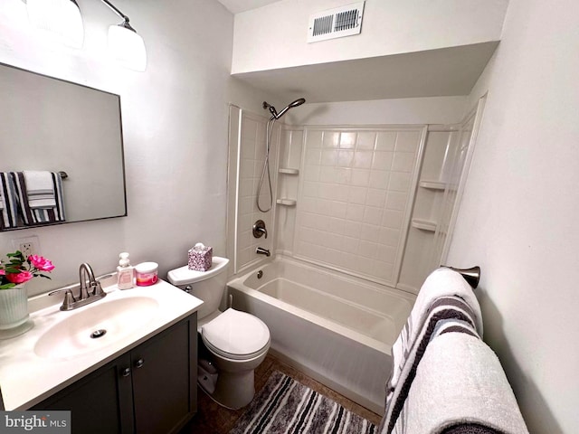 bathroom featuring toilet, vanity, and tub / shower combination