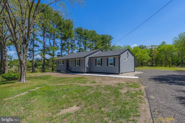 view of front of home with a front lawn and entry steps