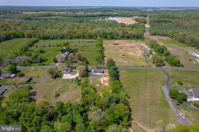 aerial view featuring a rural view and a forest view