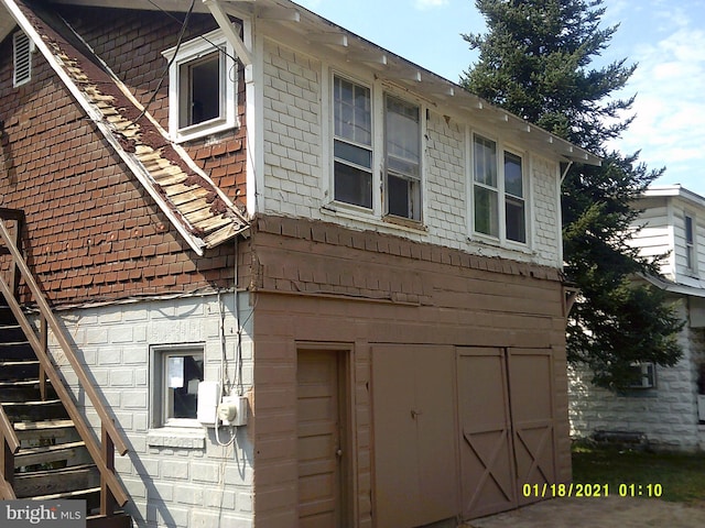 view of home's exterior with stairs