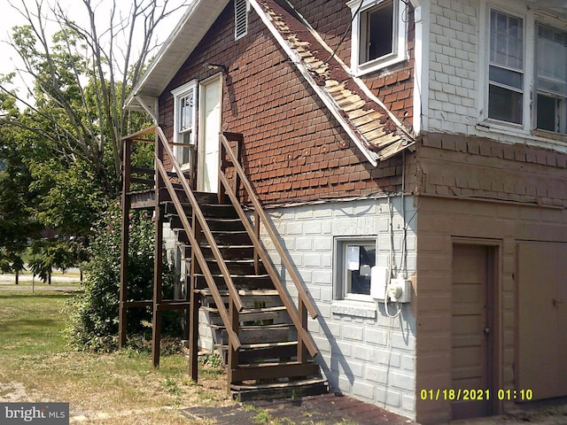 view of property exterior featuring stairway