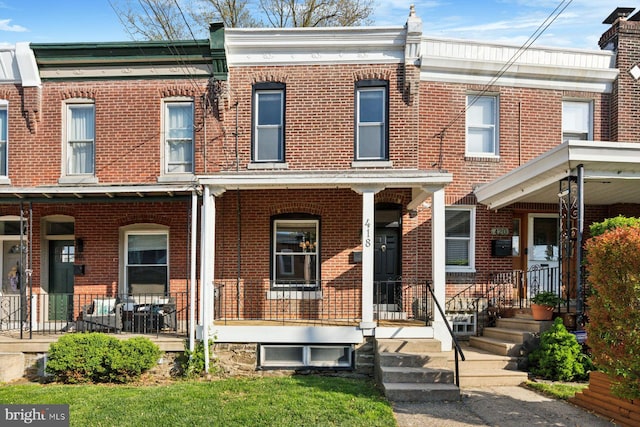 418 Monastery Ave, Philadelphia, PA 19128 - multi unit property featuring covered porch and brick siding