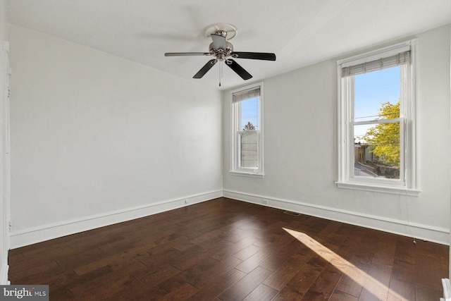 418 Monastery Ave, Philadelphia, PA 19128 - spare room featuring baseboards, a ceiling fan, and dark wood-type flooring