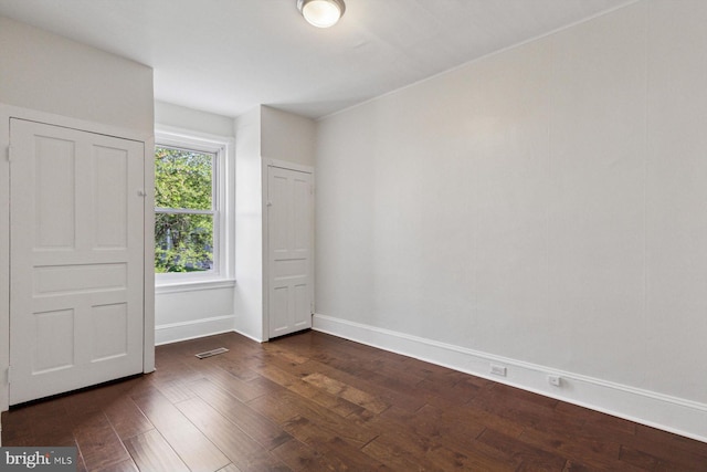 418 Monastery Ave, Philadelphia, PA 19128 - unfurnished bedroom featuring baseboards, visible vents, and dark wood-type flooring