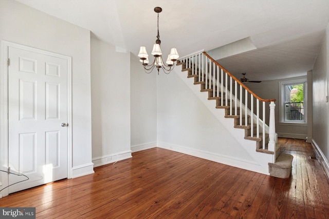 418 Monastery Ave, Philadelphia, PA 19128 - unfurnished dining area featuring baseboards, stairs, ceiling fan with notable chandelier, and hardwood / wood-style floors