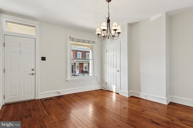 418 Monastery Ave, Philadelphia, PA 19128 - foyer entrance featuring visible vents, baseboards, a notable chandelier, and hardwood / wood-style floors