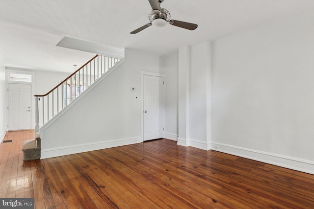 418 Monastery Ave, Philadelphia, PA 19128 - unfurnished living room with hardwood / wood-style flooring, ceiling fan, baseboards, and stairs