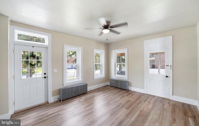 475 Farmington Ave, Pottstown, PA 19464 - foyer entrance featuring radiator, light wood-style floors, a ceiling fan, and baseboards