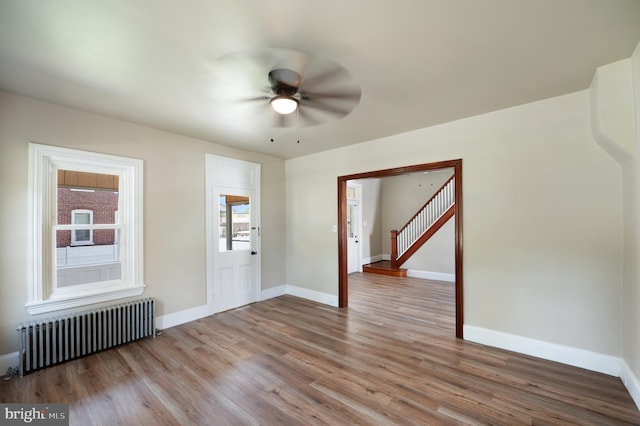 475 Farmington Ave, Pottstown, PA 19464 - foyer entrance with radiator heating unit, baseboards, a ceiling fan, and wood finished floors