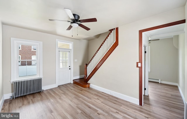 475 Farmington Ave, Pottstown, PA 19464 - entrance foyer featuring radiator, a baseboard radiator, light wood-type flooring, stairway, and ceiling fan