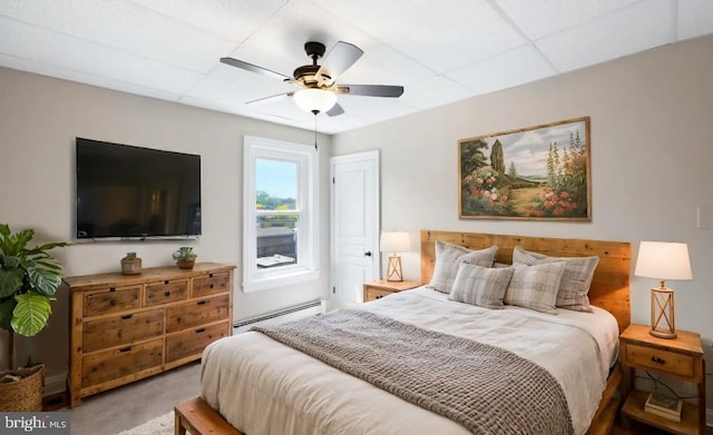 475 Farmington Ave, Pottstown, PA 19464 - carpeted bedroom with a baseboard radiator, a paneled ceiling, and a ceiling fan