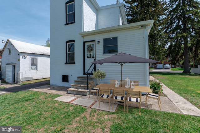 475 Farmington Ave, Pottstown, PA 19464 - back of house with a lawn, entry steps, and an outbuilding