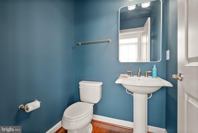 20790 Duxbury Ter, Ashburn, VA 20147 - half bathroom with toilet and wood finished floors