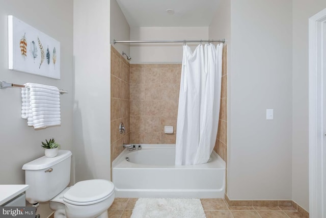 bathroom with vanity, tile patterned floors, shower / bath combo, and toilet