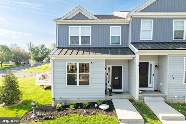 townhome / multi-family property with a standing seam roof