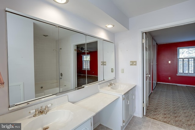 full bath featuring baseboards, shower / bathing tub combination, and vanity