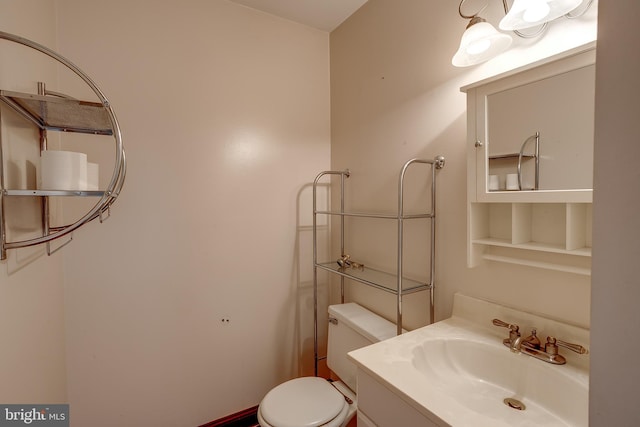 half bath with vanity and toilet