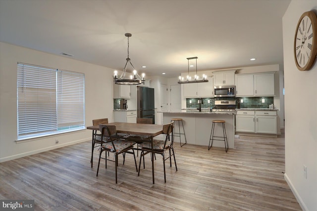 2 Shillington Ln, Carlisle, PA 17013 - dining area with recessed lighting, baseboards, light wood finished floors, visible vents, and a chandelier