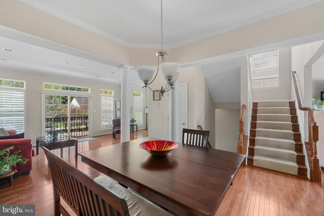136 Martha Lewis Blvd, Havre De Grace, MD 21078 - dining room featuring ornamental molding, stairs, decorative columns, a chandelier, and light wood-style flooring