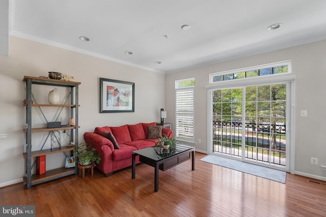 136 Martha Lewis Blvd, Havre De Grace, MD 21078 - living area featuring crown molding, baseboards, wood finished floors, and visible vents