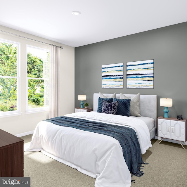 bedroom with baseboards, carpet, and multiple windows