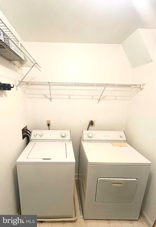 laundry room featuring laundry area and washing machine and clothes dryer