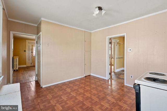 interior space featuring parquet floors, radiator, baseboards, ornamental molding, and white electric range