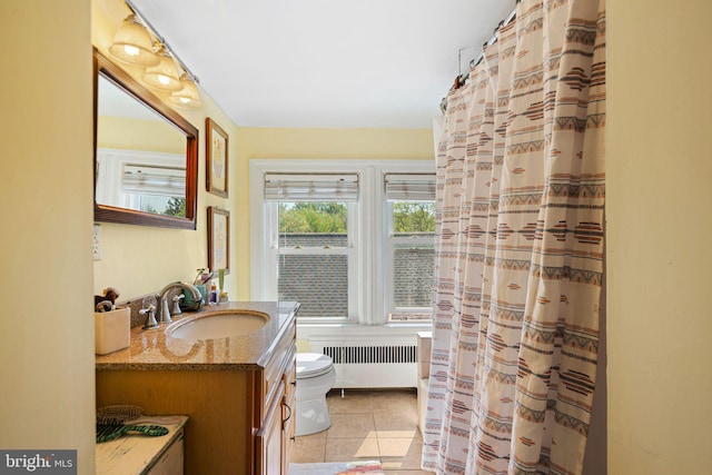bathroom with a shower with curtain, vanity, tile patterned floors, toilet, and radiator heating unit