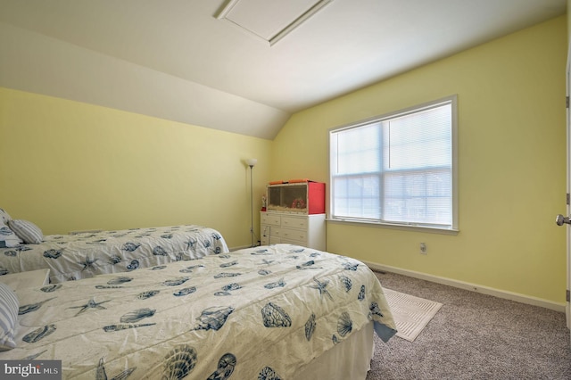 carpeted bedroom with baseboards and lofted ceiling