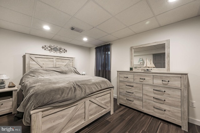 bedroom with recessed lighting, baseboards, visible vents, and dark wood finished floors