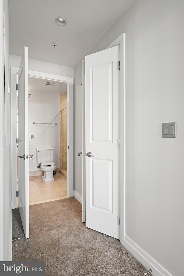 hall with baseboards, carpet flooring, recessed lighting, and visible vents